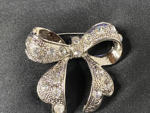 Various vintage silver tone rhinestone bow brooch