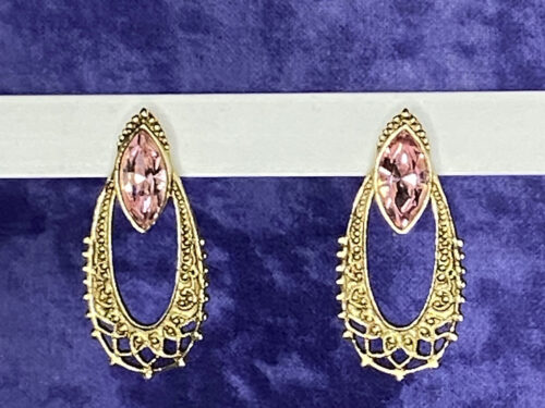 Vintage gold tone earrings with pink faceted glass
