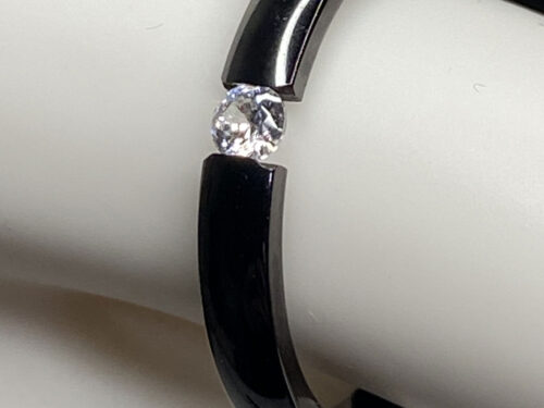 Various pre-loved black titanium ring with cz