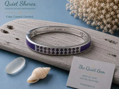 Retired Lia Sophia "Pop Rocks" silver tone fold-over stretch bracelet featuring glossy purple enamel and sparkling purple crystal accents displayed on a white jewelry stand.