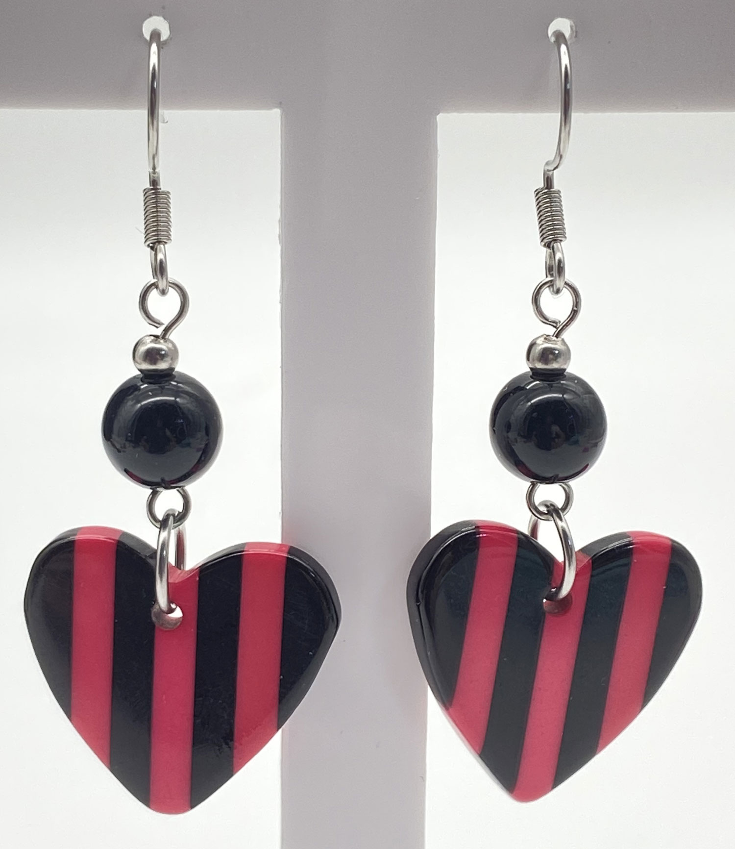 Newly designed upcycled black and pink striped heart drop earrings with black resin beads