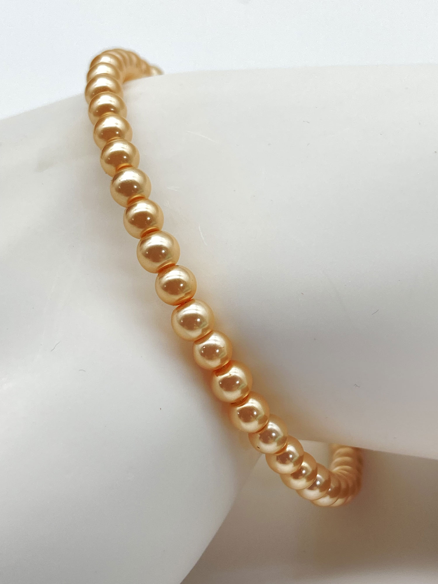 Newly designed upcycled peach memory wire layering bracelet in small - medium size
