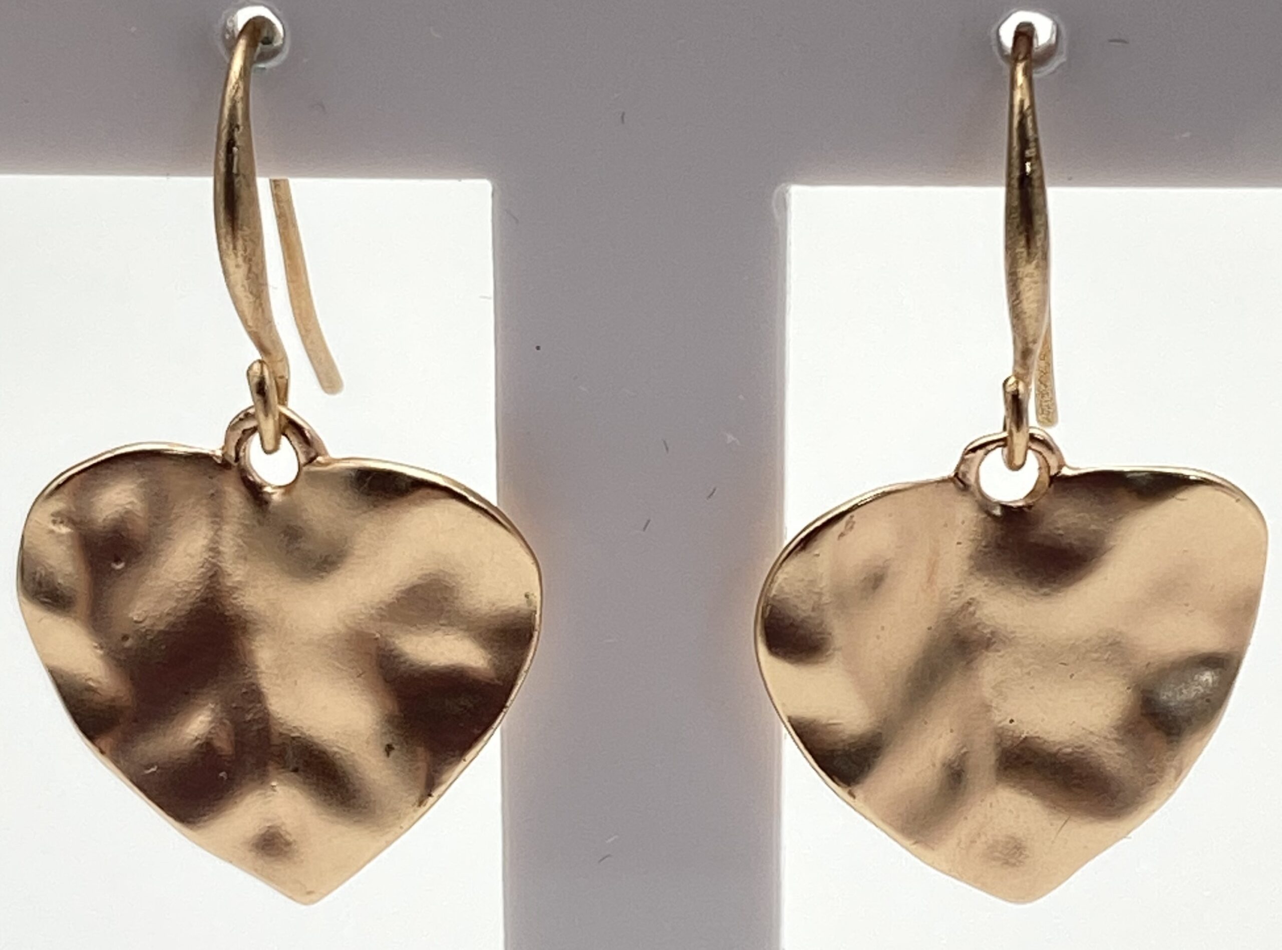 Pre-owned gold tone hammered heart drop earrings with textured heart-shaped charms.