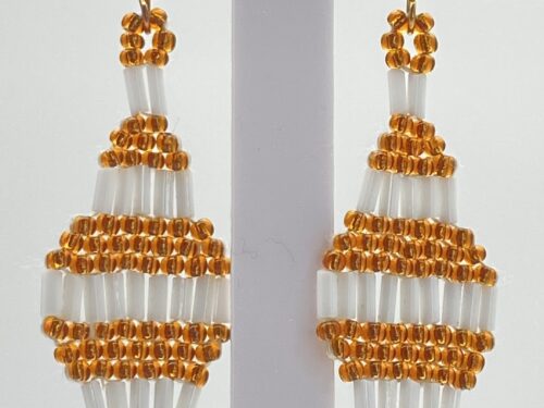 Pre-owned amber and white seed bead geometric dangle earrings with an intricate layered design.