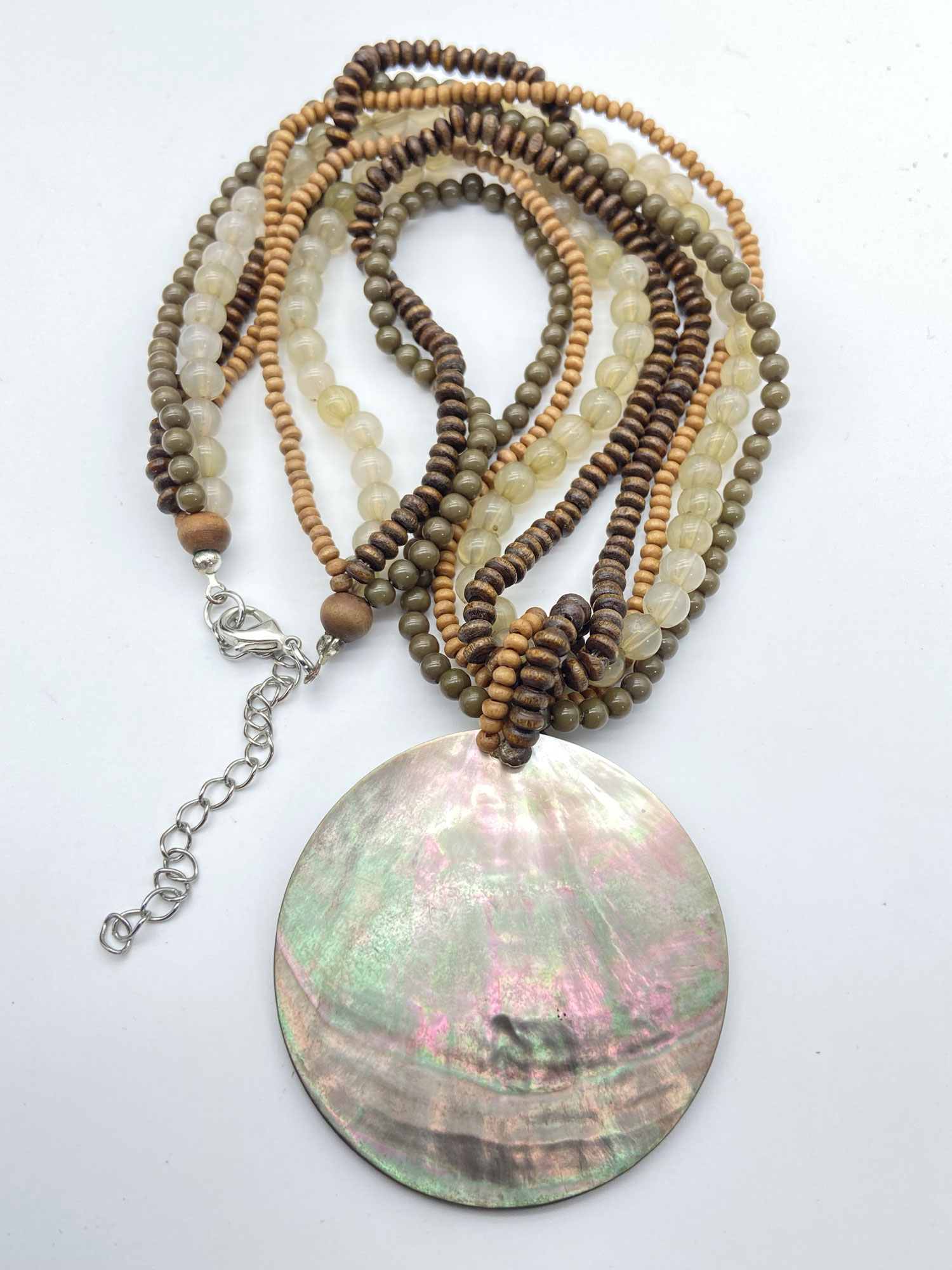 Pre-owned multi-strand wood and glass bead necklace with round iridescent mother-of-pearl pendant