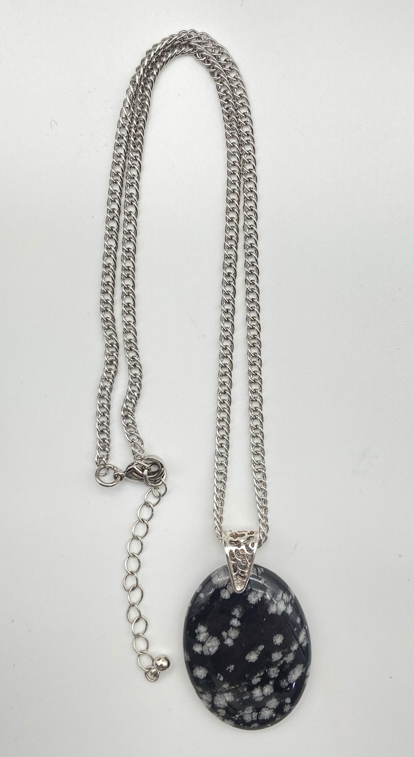 Pre-owned Snowflake Obsidian pendant necklace with polished black and white patterned stone