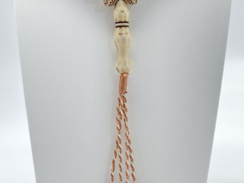 Pre-owned 99 prayer bead necklace with patterned natural-tone beads and long copper-tone tassel strands.