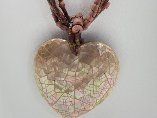 Pre-owned multi-strand wood beaded necklace with earthy brown beads and an iridescent mosaic Mother of Pearl heart pendant.