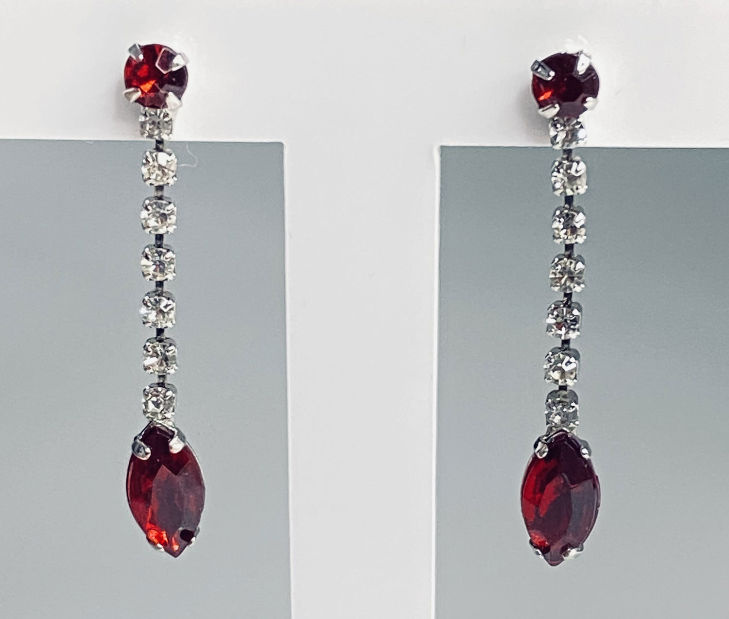 Pre-owned silver-tone earrings with clear rhinestones and red faceted drops