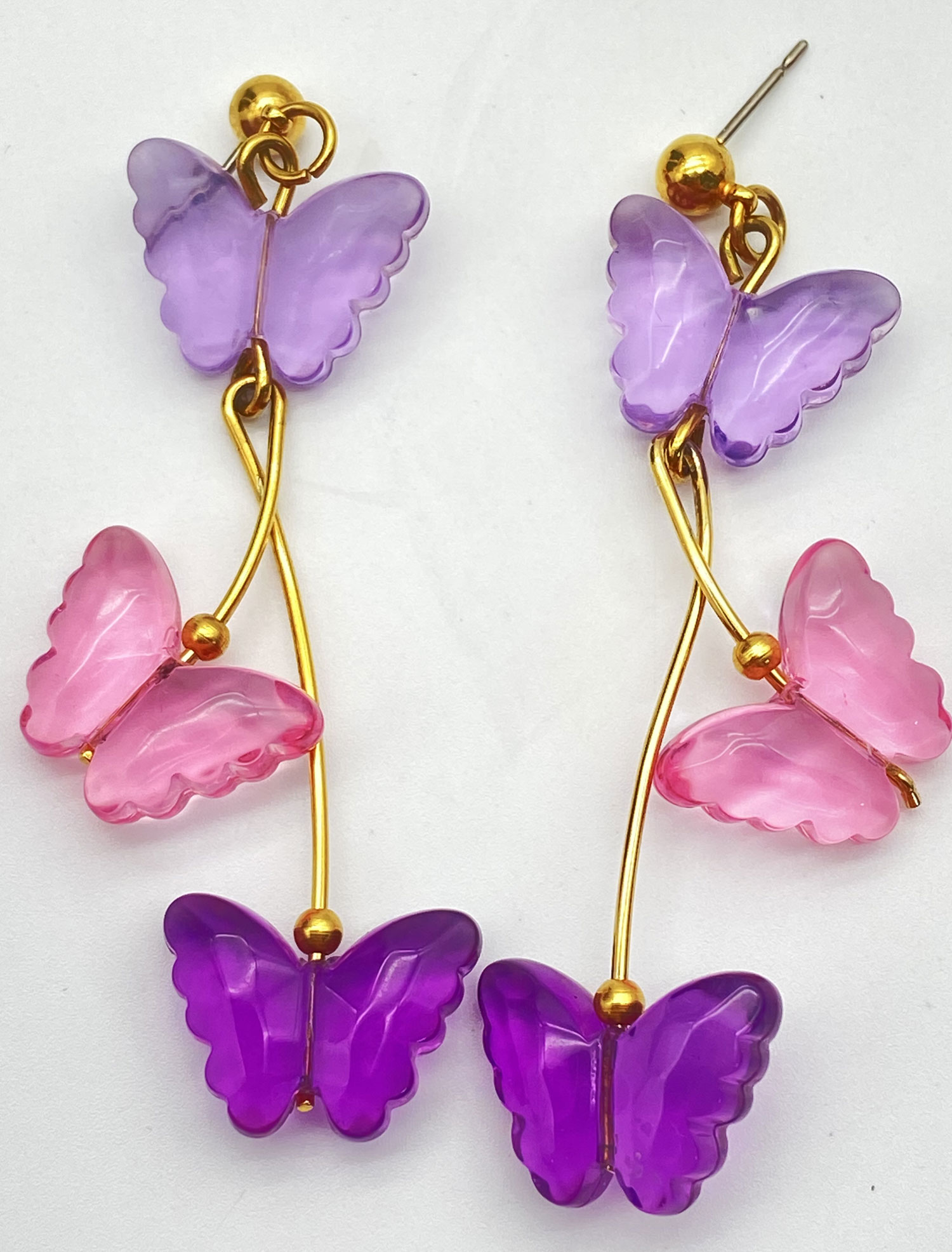 Pre-owned Lucite butterfly earrings with lavender pink and purple butterflies and gold-tone accents