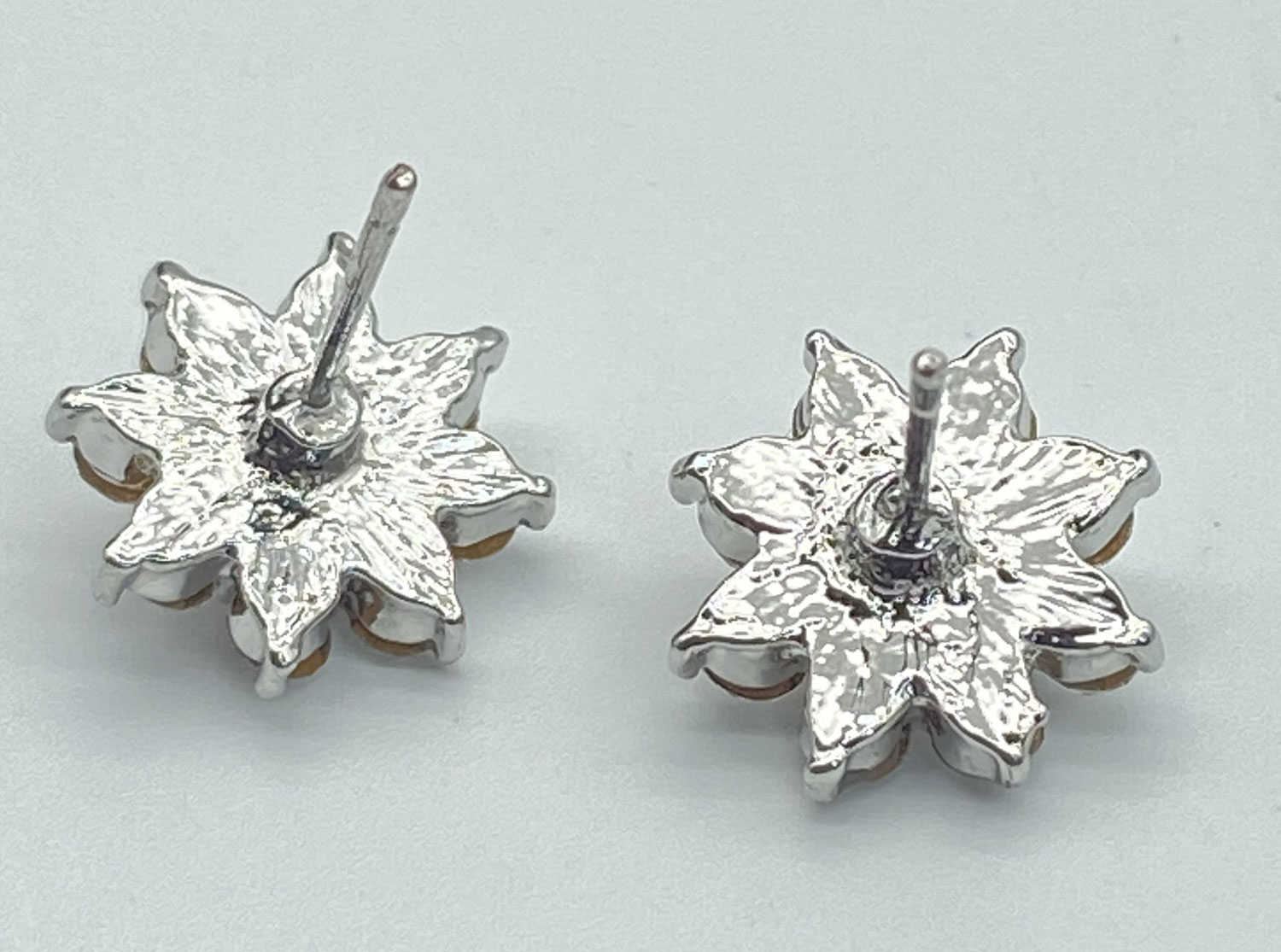 Pre-owned yellow AB rhinestone post earrings surrounded by clear rhinestones