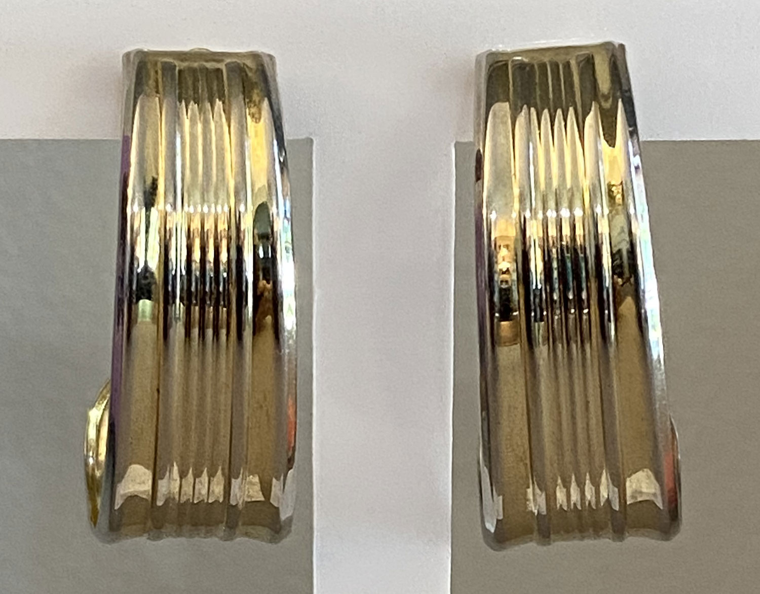 Pre-owned gold tone channel ribbed post earrings with rectangular textured design