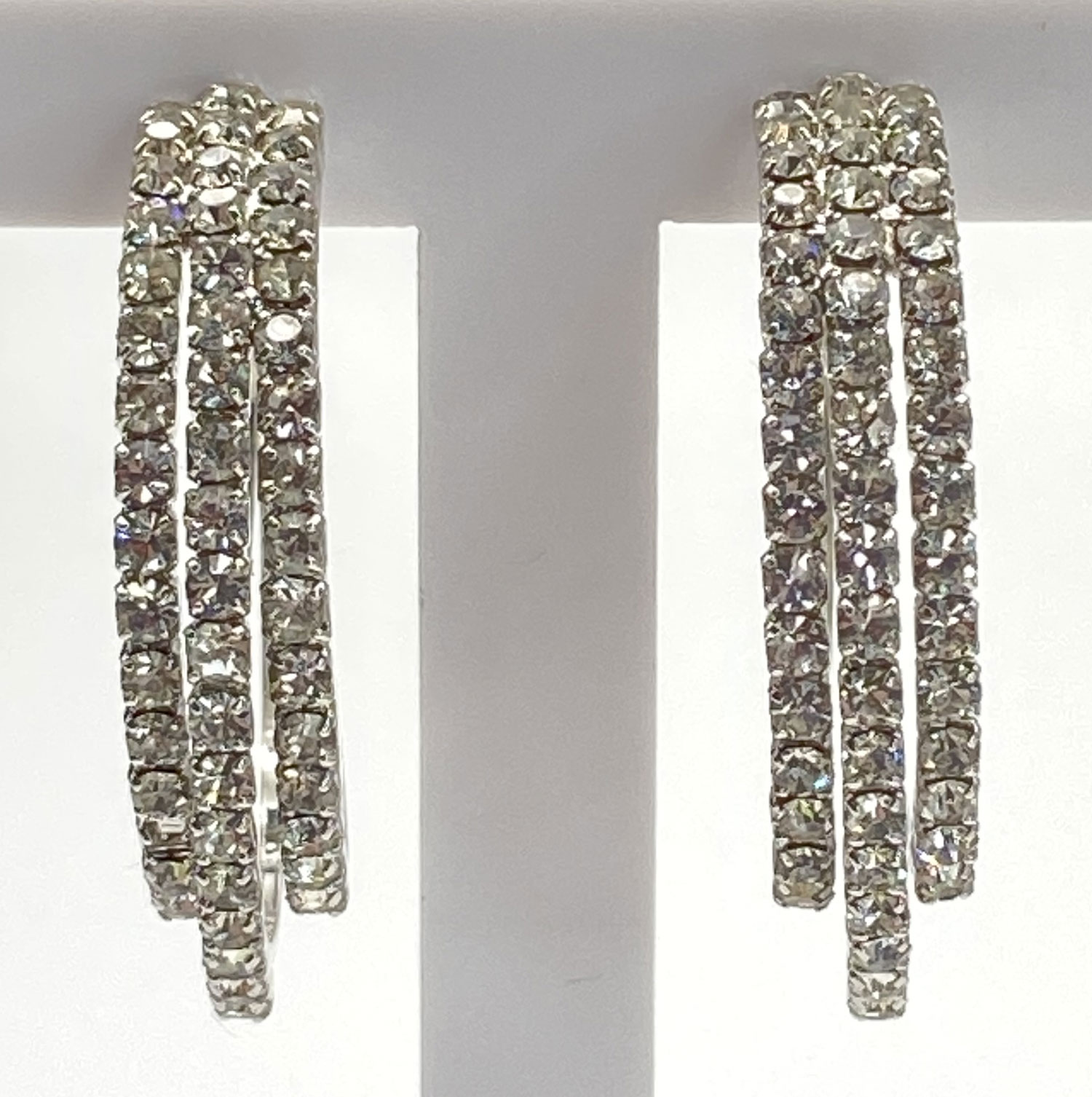 Pre-owned rhodium-plated silver-tone rhinestone half-circle post earrings with multiple sparkling drops