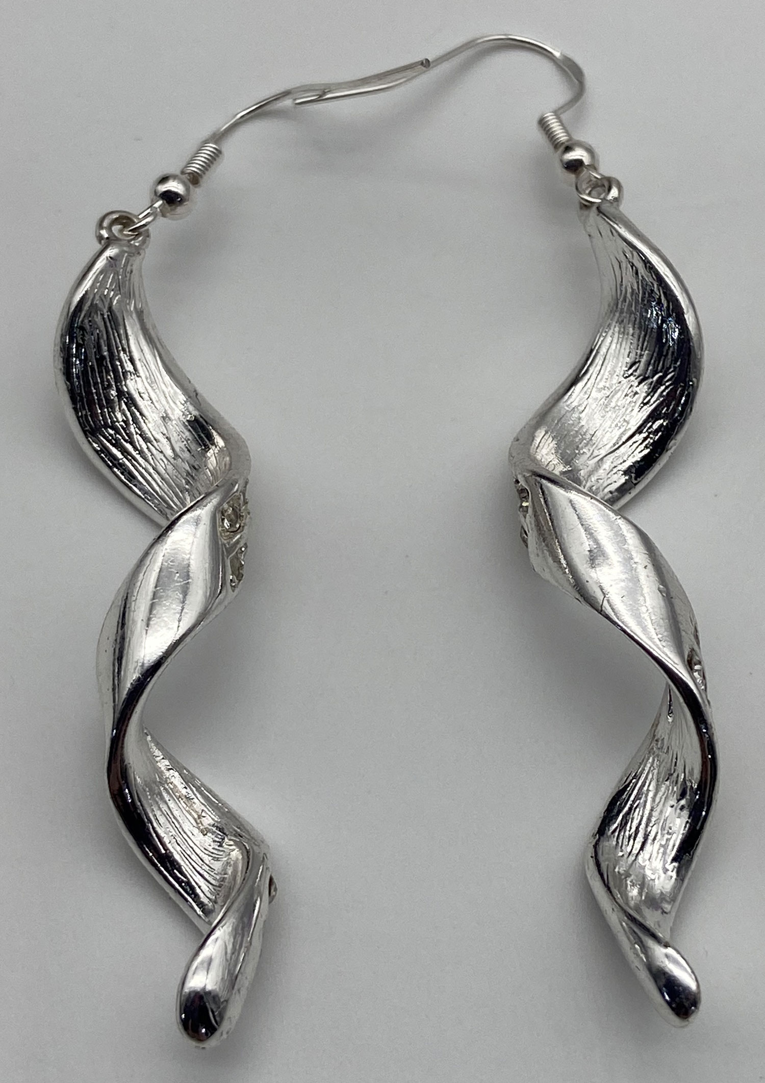 Pre-owned rhodium-plated silver-tone rhinestone spiral drop earrings with new 925 sterling silver ear wires