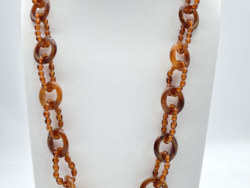 Vintage 34-inch amber-tone beaded necklace with linked honey and brown ring accents