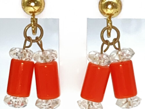 Vintage red-orange Lucite cylinder bead screw-back earrings with clear faceted accents and worn gold-tone ear wires