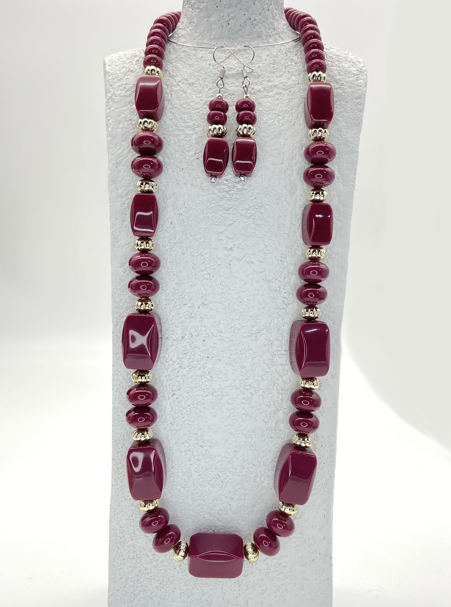 Pre-owned berry-purple acrylic beaded necklace with gold-tone accents and matching drop earrings, displayed as a coordinated jewelry set.