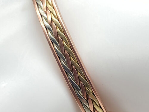Pre-owned open cuff bracelet featuring an intertwined braided-style design in copper, brass, and silver tones.